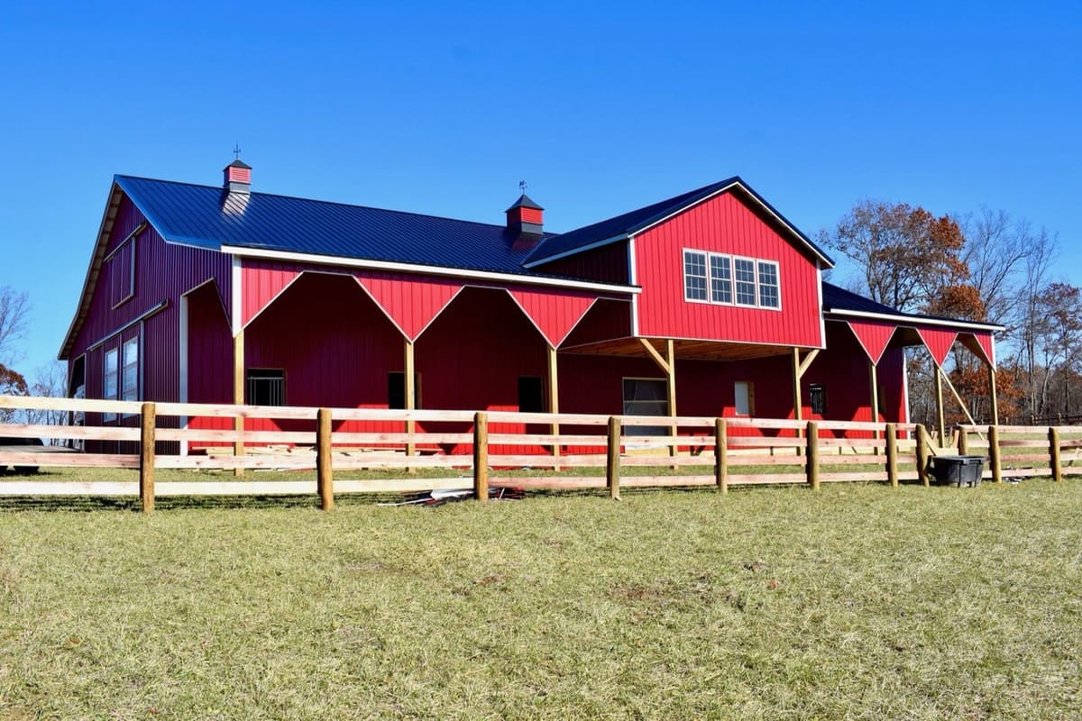 Red barn with navy metal roof