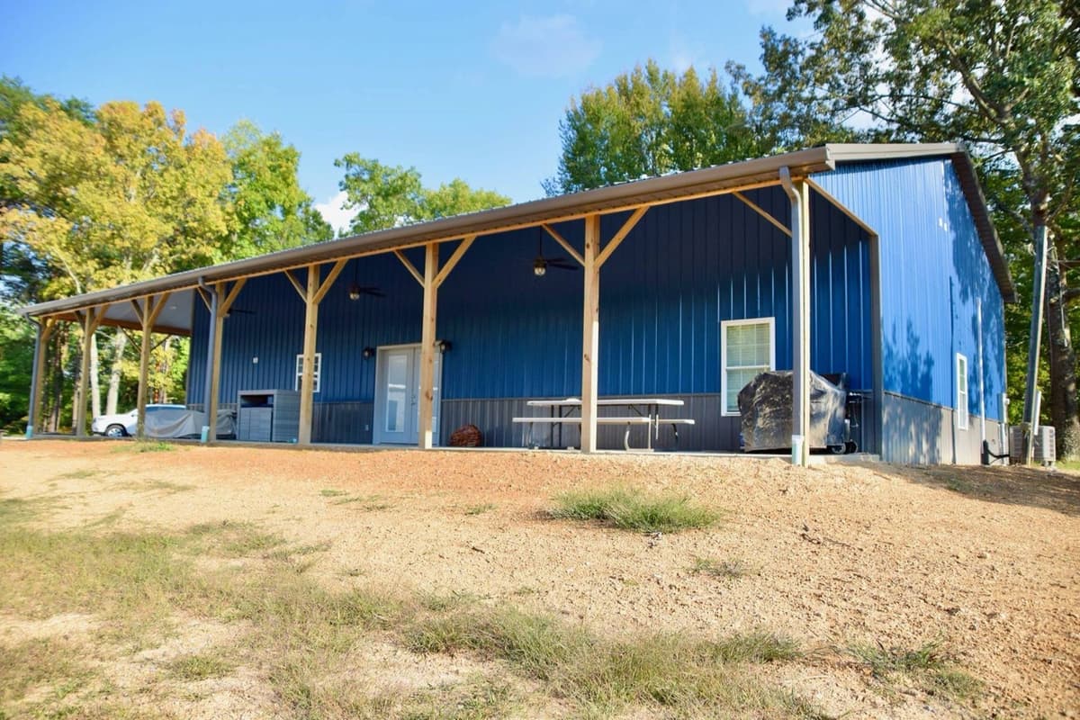 Barndominium home with covered porch